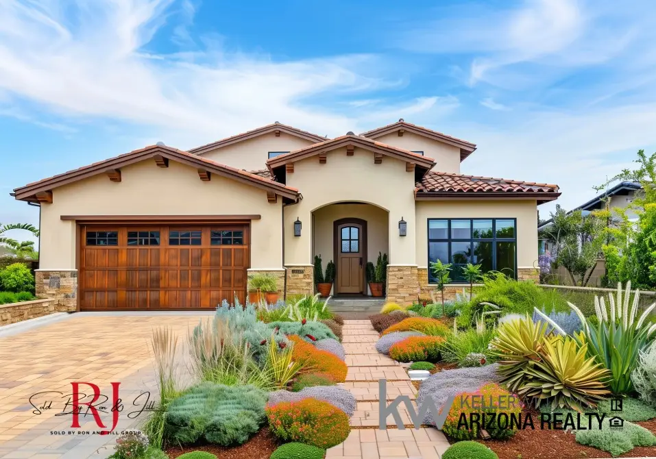 Front view of a beige, single-story house with a three-gable roof, dark wood garage door, and a desert-inspired front yard.